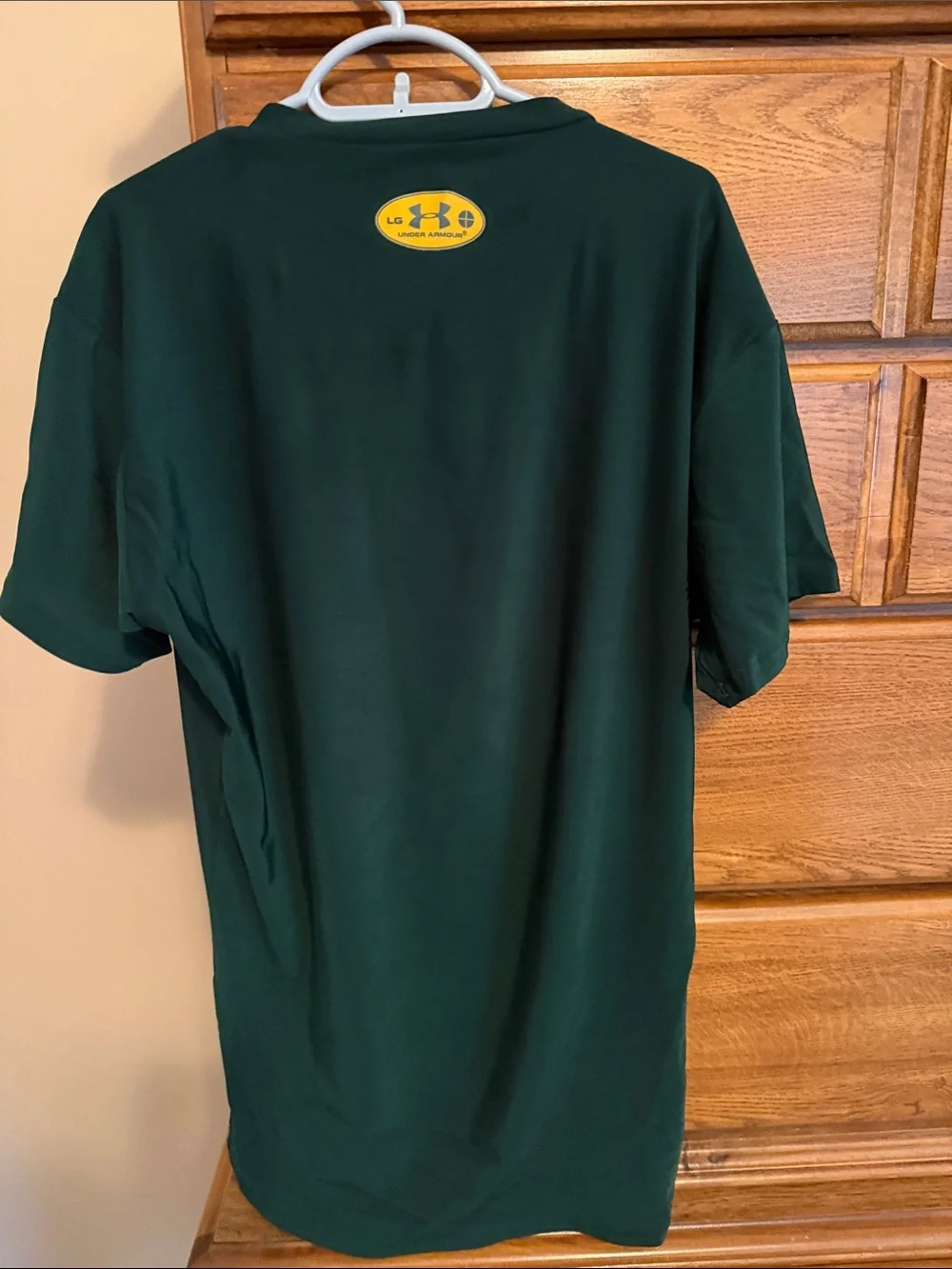 Under Armour boy’s  Forest Green Short Sleeve Performance Tee with Yellow Logo
